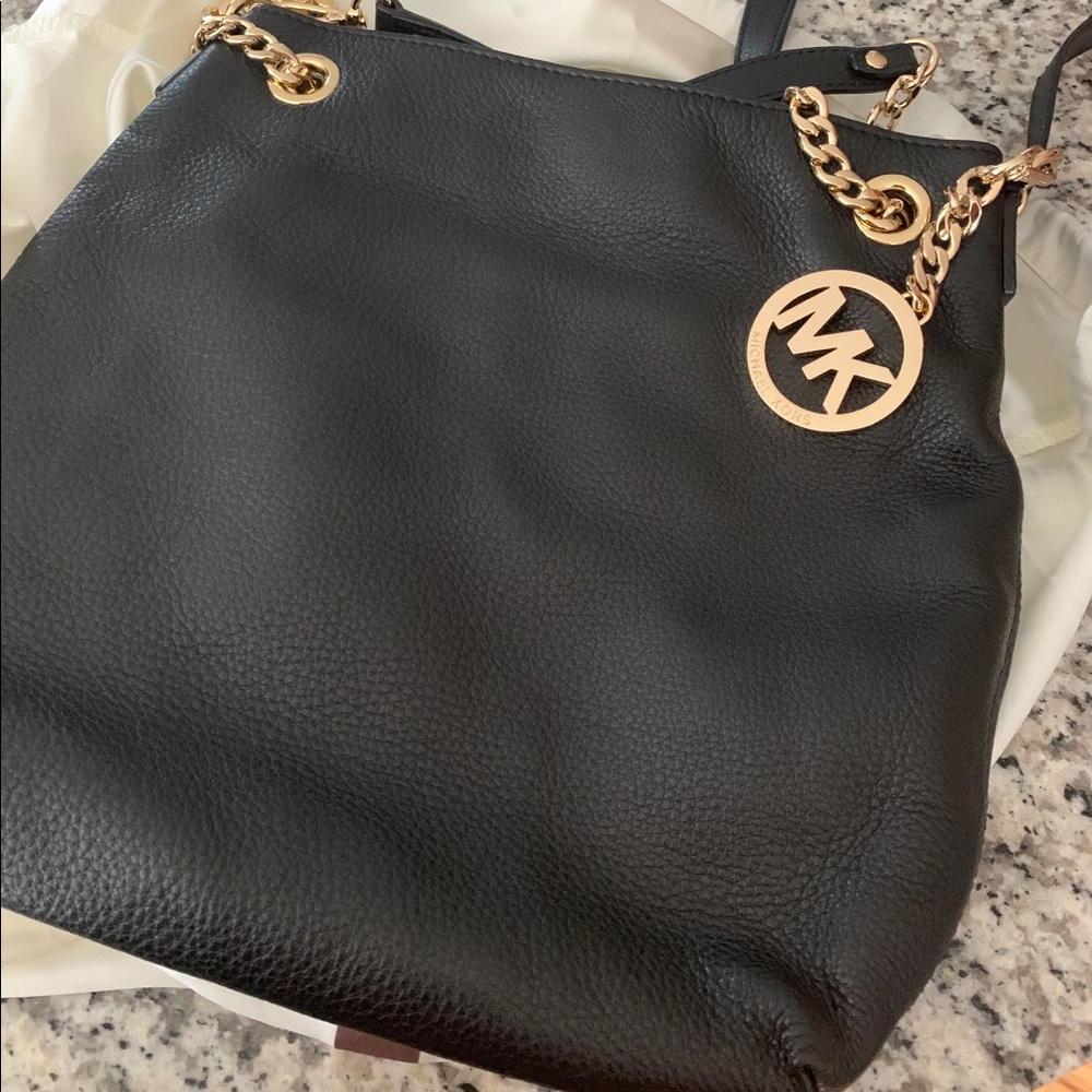Micheal Kors bag in duster like new